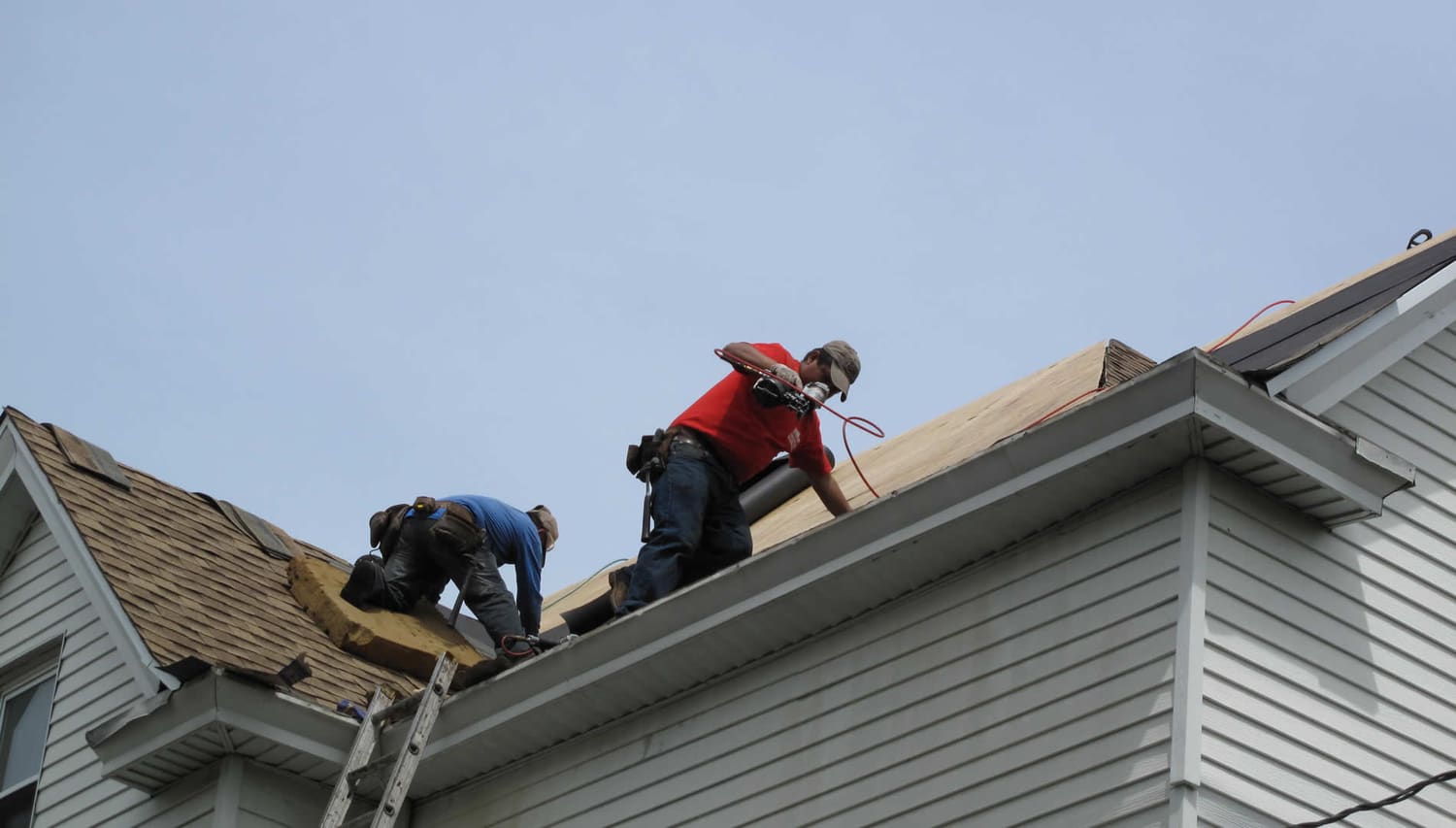 Crew installing shingles